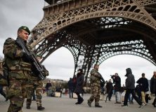 French troops patrol around the Eifel Tower on January 12, 2015 in Paris, France.